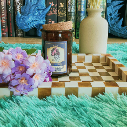 A Truth Universally Acknowledged Candle on chequered board with flowers